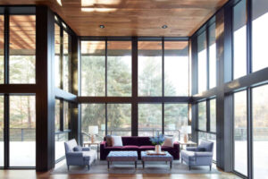 a remodeled interior space with expansive windows